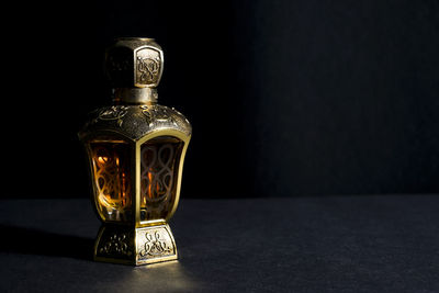 Close-up of glass bottle on table