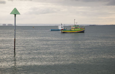 View of sailboat in sea against sky