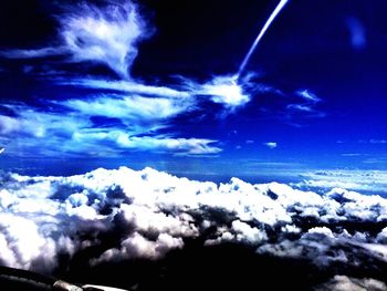 Scenic view of landscape against cloudy sky