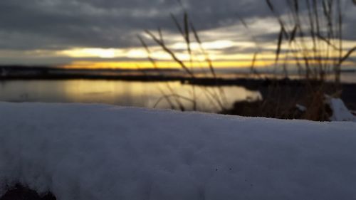 Scenic view of lake at sunset