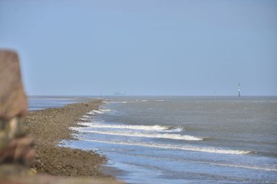 Scenic view of sea against clear sky