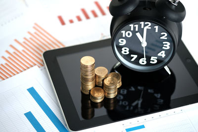 High angle view of clock on table