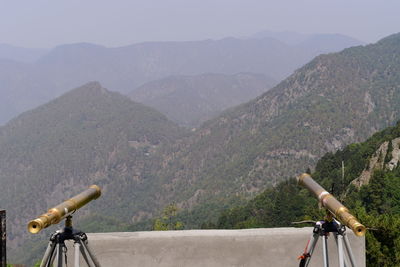 View of bicycle on mountain against sky