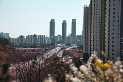 Panoramic view of city buildings against sky