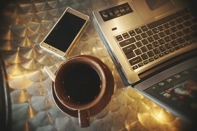 High angle view of coffee cup on table