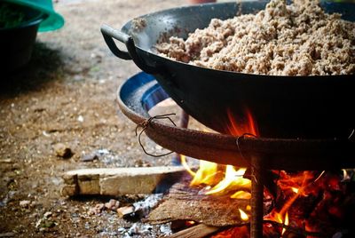 Cooking food with open fire