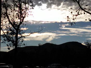 Scenic view of mountains against cloudy sky