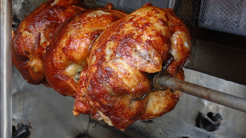 Close-up of chicken on barbecue grill