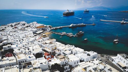 Aerial view of buildings by sea 