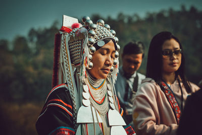 Female friends in traditional clothing outdoors