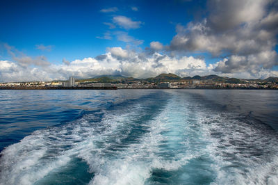 Scenic view of sea against blue sky