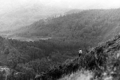 High angle view of man hiking on mountain