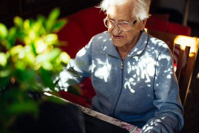 Portrait of smiling woman sitting outdoors