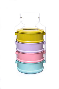 Close-up of colorful lunch box against white background