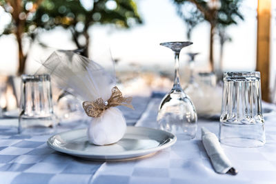 Close-up of white wine glass on table in restaurant