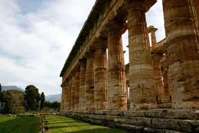 Low angle view of old ruins against sky