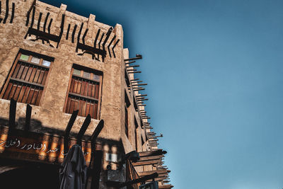 Low angle view of building against blue sky