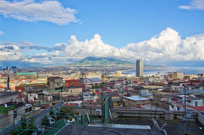 High angle view of town against cloudy sky