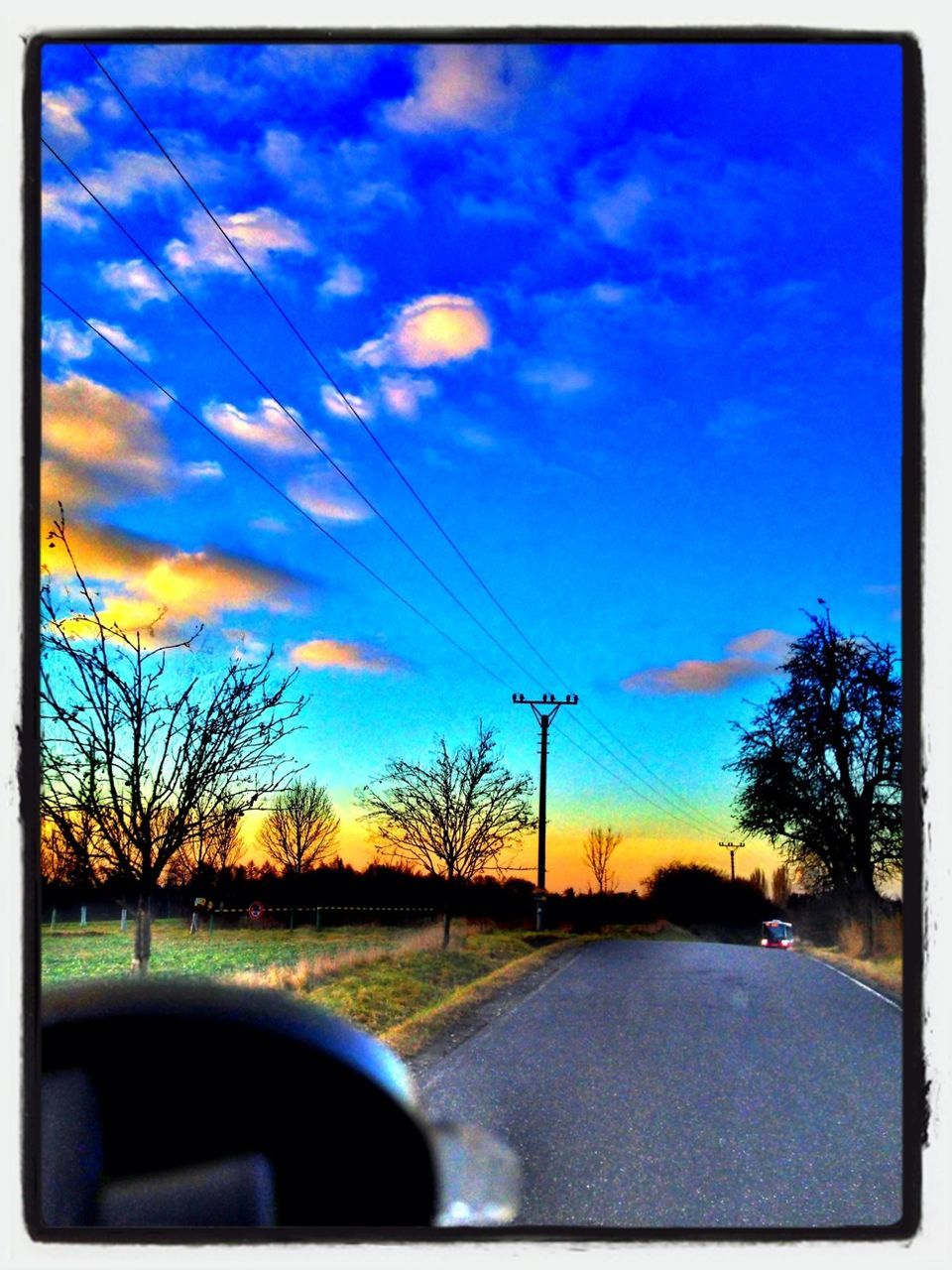 sky, transfer print, transportation, road, tree, sunset, cloud - sky, auto post production filter, car, blue, cloud, water, tranquil scene, scenics, silhouette, the way forward, tranquility, beauty in nature, nature, land vehicle