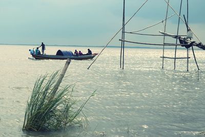 People travelling in boat on sea