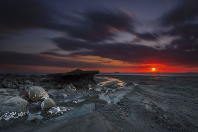 Scenic view of sea against sky at sunset