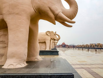 Statue of historic building against sky