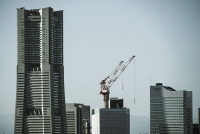 Modern buildings against clear sky in city