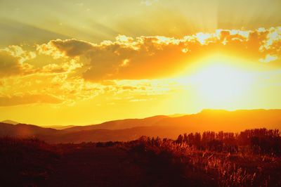 Scenic view of landscape against sky during sunset