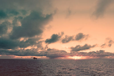 Scenic view of sea against sky at sunset