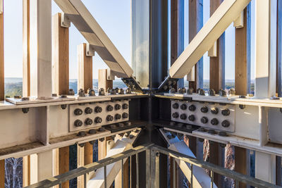 Detail of steel screw bolts connecting massive industrial steel construction