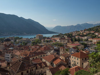 High angle view of townscape and mountains against sky