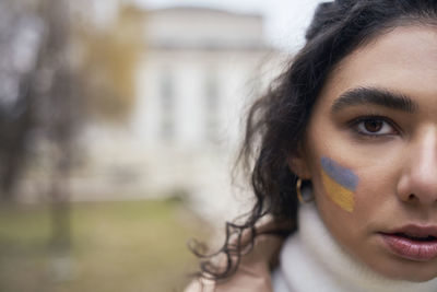 Close-up of young woman looking away