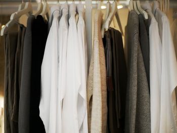 Clothes hanging on rack in store