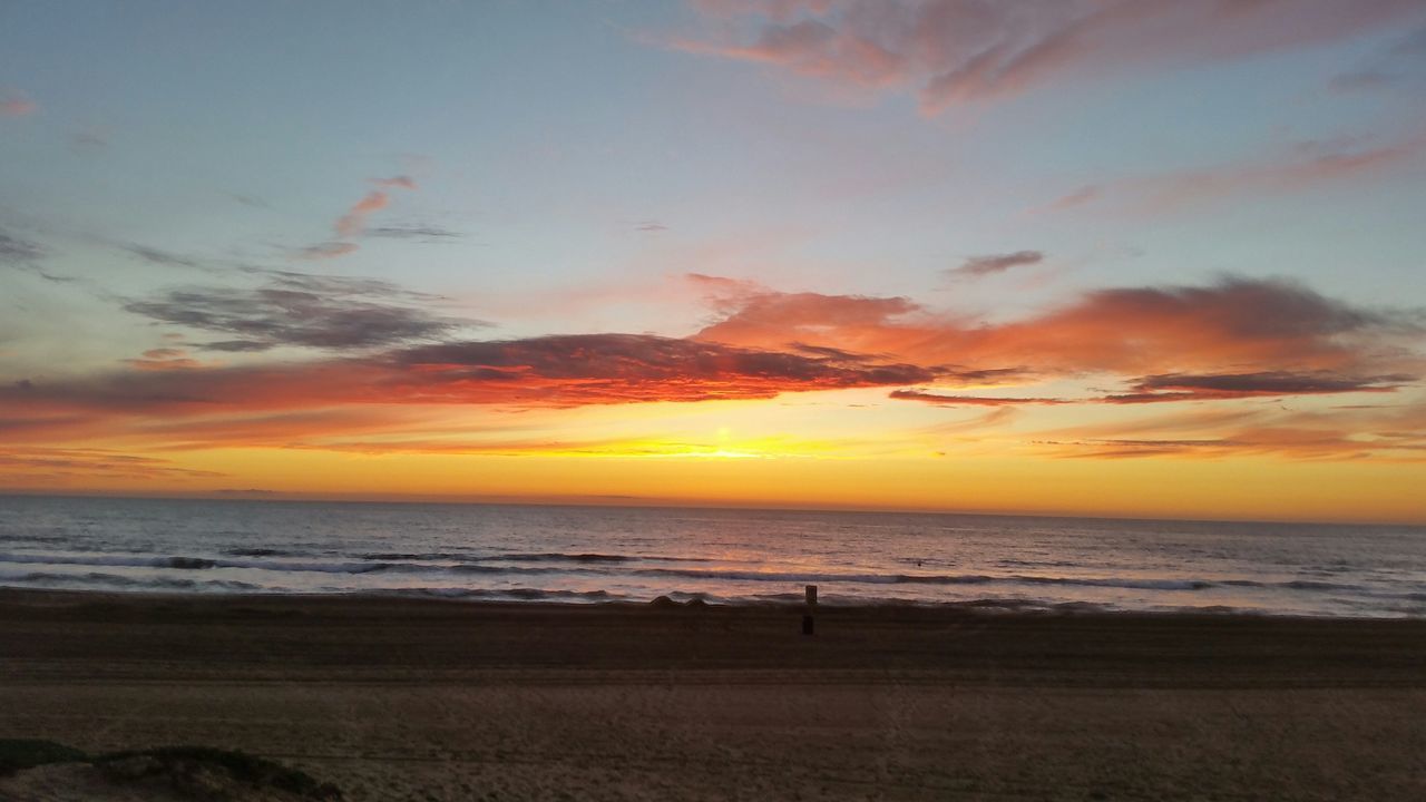 sea, horizon over water, beach, sunset, water, scenics, shore, sky, beauty in nature, tranquil scene, tranquility, orange color, idyllic, cloud - sky, nature, sand, cloud, wave, coastline, outdoors