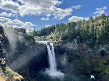 Panoramic view of river amidst trees against sky