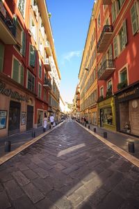 Street amidst residential buildings