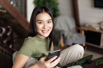 Young woman using phone