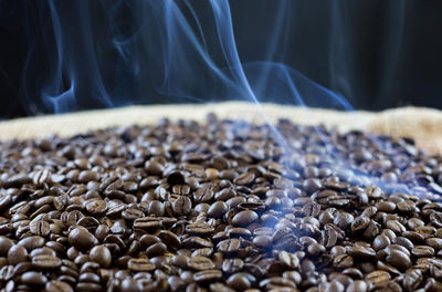 Close-up of smoke emitting from coffee beans