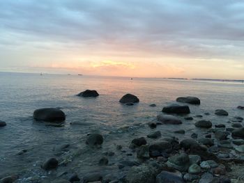 Scenic view of sea against sky at sunset