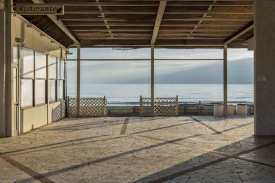 Scenic view of sea against sky seen through window