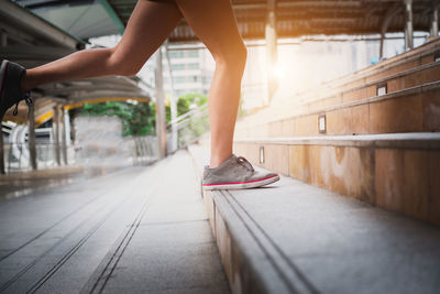 Beautiful scenery of two female joggers pursuing their activity outdoors in the city.