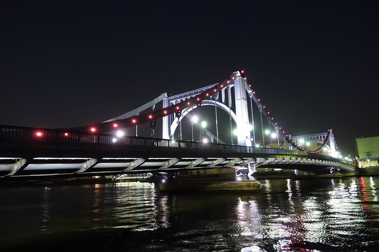 connection, bridge - man made structure, transportation, water, architecture, built structure, engineering, river, illuminated, night, bridge, waterfront, suspension bridge, travel destinations, travel, clear sky, famous place, copy space, city, international landmark