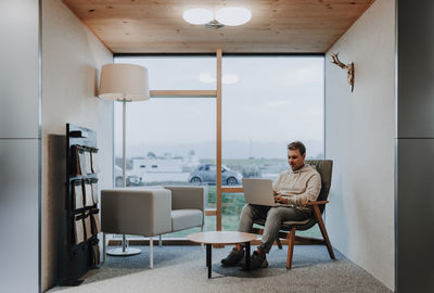 Young business man is writing on a notebook, he is busy and working hard in his home office 