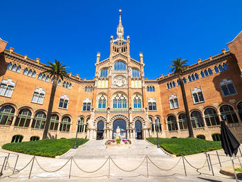 Low angle view of building against blue sky