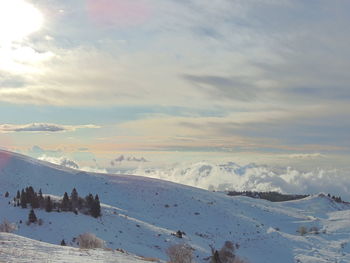 Scenic view of mountains against sky during winter