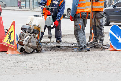 Low section of people working on road