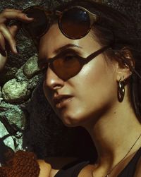 Close-up portrait of young woman looking away