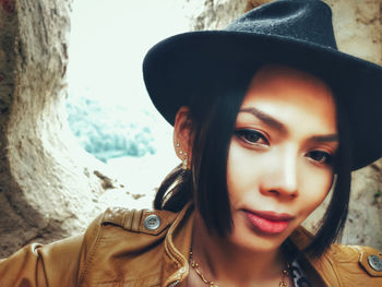 Close-up portrait of smiling young woman