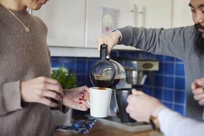 Co-workers having coffee during break