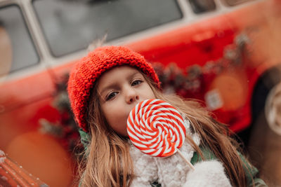 Portrait of smiling young woman blowing bubbles